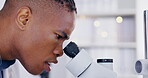 Science, microscope and sample with a doctor man at work in a laboratory for innovation or breakthrough. Medical, research and zoom with an african male scientist working in a lab for an experiment