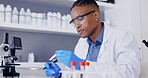 Scientist, writing and blood test tube in vaccine research, virus test or healthcare solution in science laboratory. Black man or doctor in biotechnology, medical analysis and dna, red liquid or data