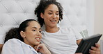 Tablet, bed and couple of friends relax on streaming service, website or online application in lgbtq love at home. Planning, typing and happy lesbian women or people on digital technology in bedroom