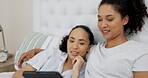 Couple of friends, relax and bed on tablet streaming service, website or online application in lgbtq love at home. Planning, typing and happy lesbian women or people on digital technology in bedroom