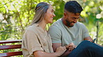 Happy couple, phone and laughing on park, bench and garden for social media post, funny meme and online joke. Man, woman and people in love relaxing outdoor with smartphone, mobile app and technology