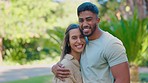 Park, hug and face of happy interracial couple for bonding, quality time and relaxing on weekend date. Relationship, dating and portrait of man and woman embrace for trust, commitment and romance