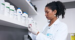 Scientist, woman and blood test tube for research, testing or experiment in laboratory. Doctor, science and person looking at medical sample or vial for dna analysis, examination or studying biology.