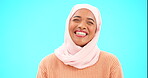 Muslim woman, laugh and happy portrait with a scarf for mockup, advertising or joke. Islamic female model with makeup and hijab laughing for comic emoji, funny meme or fashion on blue background