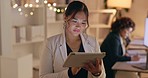 Office, night and business woman on digital tablet for project, inspiration and deadline in coworking space. Overtime, corporate and asian lady employee online for research, idea and creative vision