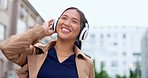 Happy, dance and woman in the city, headphones and streaming music for stress relief, celebration and cheerful. Female, person or happy lady with headset, listening audio and song with joy or dancing