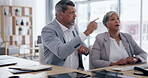 Collaboration, computer and laptop with business people in an office, working together on an email or report. Teamwork, management and assistance with a man employee helping a woman colleague at work