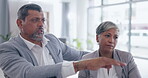 Teamwork, computer and laptop with senior business people in an office, working together on a report. Collaboration, management and assistance with a man employee talking to a woman colleague at work