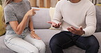 Couple, divorce and disagreement or argument on sofa in living room dispute or unhappy relationship at home. Frustrated or upset woman and man talking in breakup, cheating or affair in conflict fight