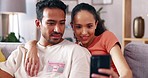 Phone, relax and home couple watch social media video, streaming subscription content or browse website. Love, hug and talking man, woman or online shopping people surfing internet website in lounge