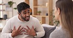 Couple, divorce and fight in disagreement or argument on sofa in living room dispute or unhappy relationship at home. Frustrated or upset woman and man talking in breakup, cheating or conflict affair