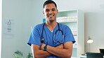 Portrait, Indian doctor or face of happy man with smile in a hospital clinic for wellness, helping or nursing Trusted nurse, medical surgeon or proud healthcare consultant smiling or working alone