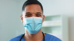 Doctor man, portrait and covid mask on face for healthcare, medical help and safety compliance in hospital. Professional person, nurse or surgeon with ppe for health, wellness and support in clinic
