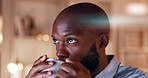 Black man, coffee and business employee in a office late at night thinking with ideas. Businessman, working and corporate work of a African worker reading computer data for planning on company tech