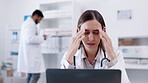 Laptop, healthcare and headache with a doctor woman at work in a hospital for innovation or research. Computer, medical and pain with a medicine professional suffering from a migraine in a clinic