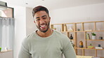 Laughing, happy and relax with man in living room for free time, break and satisfaction. Smile, funny and happiness with portrait of male standing at home for weekend, calm and positive mindset