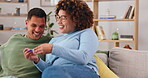 Surprise, pregnancy test and good news with a couple celebrating together on a sofa in the living of their home. Pregnant, wow or celebration with a man and woman positive about their test result