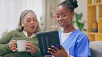 Nurse, caretaker and elderly woman talk with tablet and communication for teaching about tech. Retirement home, healthcare worker and nursing employee talking to senior about an online app on a sofa