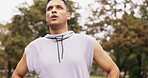 Breathing, exercise and indian man runner in a park for fitness, break and morning cardio outdoors. Sports, workout and young male relax in a forest after running, training or workout run in woods