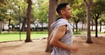 Man, running and outdoor park with athlete profile doing fitness, workout and run training. Nature trail, wellness and exercise of a male runner doing sports cardio for health and exercising goals