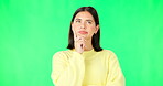 Mind, thinking and decision with a woman on a green screen background in studio to consider an option. Idea, face and contemplating with an attractive young female looking thoughtful on chromakey