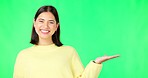 Happy woman, face and hand on green screen for product placement, advertising or marketing against studio background. Portrait of female with smile showing advertisement or sale on copy space mockup