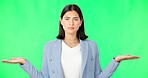 Business woman, open hands and palm by green screen for choice, decision and confused face in studio. Young businesswoman, hand gesture and portrait for product placement with mock up by background