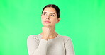 Face, thinking and option with a woman on a green screen background in studio to consider a decision. Idea, mind and contemplating with an attractive young female looking thoughtful on chromakey