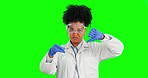 Thumbs down, face and a woman with science on a green screen isolated on a studio background. Bad, review and a scientist doing a chemistry test with liquid for research and medical innovation