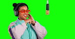 Green screen headphones, music dance and woman listening to radio song, hip hop sound or rap audio track. Fun retro artist, chroma key musician or streaming person dancing on mockup studio background