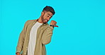 Face, man and pointing to mockup in studio isolated on a blue background. Portrait, product placement and Indian person showing advertising, marketing and branding space, promotion or commercial.