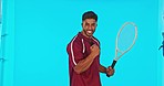 Tennis, winner and man celebrate success in studio isolated on a blue background mockup. Face portrait, racket sports and happiness of Indian person in celebration of winning, competition or champion