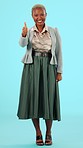 Thumbs up, business and black woman on blue background for yes, agreement and approval in studio. Emoji, success mockup and portrait of girl in corporate fashion for thank you, approve and promotion