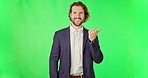 Face, green screen and man pointing, entrepreneur and  direction on a studio background. Portrait, male employee and consultant with hand gesture, choice and selection with space, smile and decision