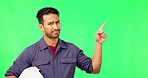 Asian man, engineer and pointing on green screen for wrong plan, no or negative against a studio background. Portrait of disappointed male contractor showing failure, incorrect or mistake on mockup