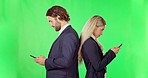 Couple, smartphone and standing on green screen with back in studio isolated on a background. Cellphone, business and man and woman texting, social media or online browsing, web networking or think.