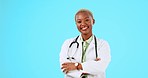 Happy black woman, portrait or doctor with smile or positive mindset in studio isolated on blue background. Copy space, face or proud African nurse smiling with arms crossed medical healthcare advice
