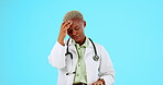 Black woman, doctor and headache in stress, anxiety or burnout against a blue studio background. African female medical professional suffering bad head pain, ache or strain and overworked on mockup