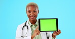 Doctor talking of tablet green screen isolated on studio background telehealth, medical or clinic presentation. Healthcare advertising. black woman face and digital technology, promo or mockup space