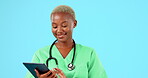 Happy healthcare, face and a black woman with a tablet isolated on a blue background in studio. Medical smile, portrait and African doctor with tech for a schedule, hospital agenda or communication
