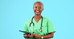 Happy black woman, doctor and tablet for healthcare research or life insurance against a blue studio background. Portrait of African female medical expert face with smile and technology on mockup