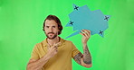 Green screen secret, man and mockup speech bubble for review opinion, social media voice or brand tracking markers. Hush silence, wink or portrait person point at chroma key sign on studio background