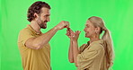 Keys, homeowner and surprise with a couple on a green screen background hugging in celebration in studio. Portrait, real estate or wow with a man and woman cheering together after a property purchase
