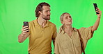 Phone, couple and search for signal on green screen in studio isolated on a background. Cellphone, network problem and confused man and woman with glitch, 404 error and poor cellular connection.
