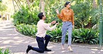 Woman, reject man and proposal in park for anger, sad and disappointment with fail, mistake or regret. Couple, marriage offer and ring with girl, refuse and walk with angry face to break up with guy