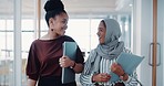 Business, happy women and discussion while walking in office for teamwork, collaboration and chat. Diversity, female employees and talking in conversation, speaking and networking in global company