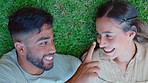 Above, happy couple and touch nose at park, lawn and nature for love, care and support of quality time together. Young man, woman and relax on grass for fun, freedom and playful date in summer garden