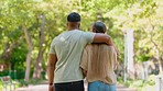 Back of couple walking with arm around in park for commitment to love, care or romantic date in sunshine. Man, woman and partner in garden of trust, quality time and freedom to relax together outdoor