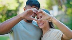 Heart hands, closeup and couple outdoor for love, kindness and commitment to partner in park. Happy people, finger shape and sign of support, trust and care of icon, emoji and loyalty in relationship