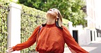 Freedom, celebration and asian woman in a street happy for good news, promotion or new job. Open arms, gratitude and female celebrating beginning, employment and success, winning and thankful